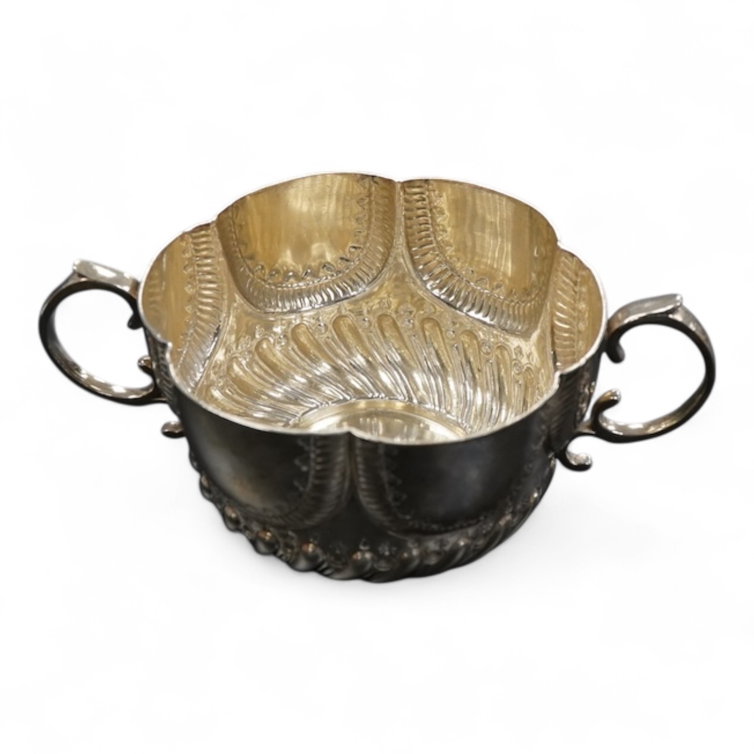 A late Victorian silver twin handled porringer in ealry 18th century style hanlded to handle 17cm., weight approx. 6.48ozt
